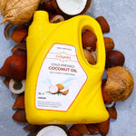 container of Indiyeah coconut oil surrounded by coconuts and nuts on a light background