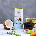 Can of Indiyeah coconut oil with a coconut, vegetables, and kitchen items on a gray background